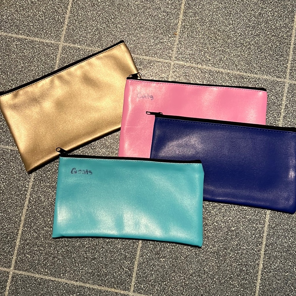 4 money bags. Hardly used but still has some sharpie in corner on some